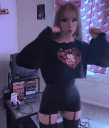 a woman in a black sweater with a cat on it