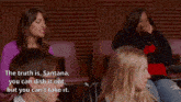 a blurry picture of a group of women sitting in a theatre