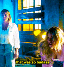 two women standing next to each other with the words that was so badass on the bottom