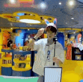 a man is taking a picture of himself in a store while wearing a bunny hat .