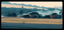 a truck and a car are drifting on a track