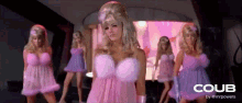 a woman in a pink dress is surrounded by other women in pink dresses and the word coub is on the bottom
