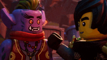two lego figures are standing next to each other and one of them has a purple face