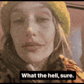 a woman wearing a yellow hat and a tiger print jacket says what the hell sure