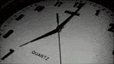 a quartz clock with the hands on the numbers 1 and 2