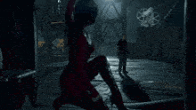 a man and a woman are standing next to each other in a video game .