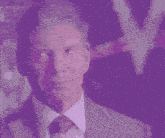 a man in a suit and tie is looking at the camera with a purple background
