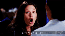 a woman talking to a man with the words oh my gosh behind her