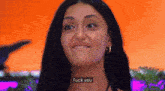 a close up of a woman 's face with the words fuck you on the bottom