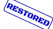 a blue and white sign that says restored on it