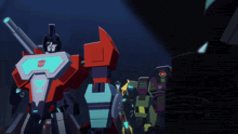a group of transformers standing next to each other in a dark room