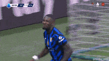 a soccer player is celebrating a goal during a game