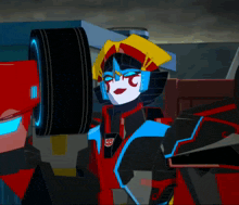 a transformer with a red and blue face is holding a wheel