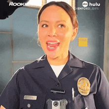 a woman in a police uniform has the name chen on her badge