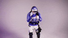 a person wearing a blue and white outfit that says ultra