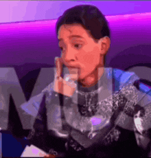 a blurry picture of a person with the letter m in the corner