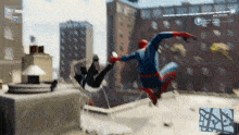 spider-man is flying through the air while another spider-man is falling