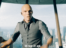 a man in a suit says wrap it up