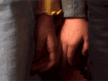 a close up of a person holding hands with another person