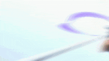 a blurry picture of a person holding a sword in their hand