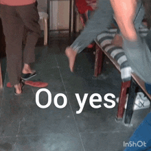 a group of people standing in a room with the words oo yes