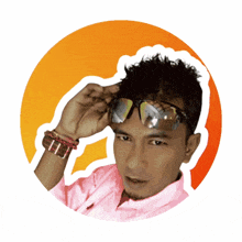 a man wearing sunglasses and a pink shirt