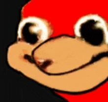 a close up of knuckles the echidna 's face with a red hat .