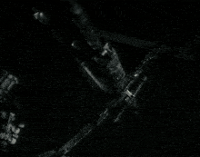 a black and white photo of a person holding a rifle