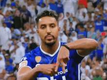 a soccer player wearing a blue shirt that says store