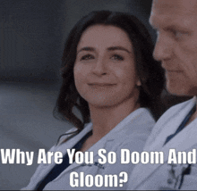 a man and a woman are sitting next to each other with the caption why are you so doom and gloom?