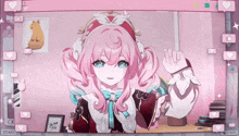 a video of a girl with pink hair is being played on a pink screen
