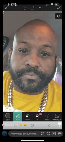 a man with a beard wearing a yellow shirt is being edited on a cell phone