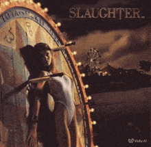 a woman is standing in front of a ferris wheel on the cover of slaughter album