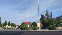 an empty parking lot with a yellow sign that says aldi on it