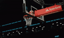 a basketball game being played in front of a crowd with a pivot sign in the background