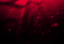 a person is swimming in a dark room with a red background