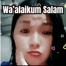 a woman 's face is shown with the words wa'alaikum salam above it