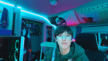 a person in a room with a ninja knight flag on the wall behind them