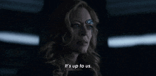 a woman with a robotic headband on her forehead says it 's up to us .