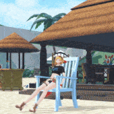 a girl is sitting in a chair on a beach