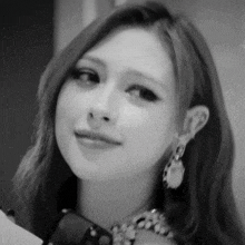 a black and white photo of a woman 's face