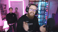 a man with a beard wearing headphones and a shirt that says world i want to on it