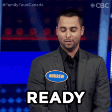 a man with a name tag that says andrew says ready