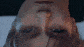 a close up of a person 's face with a triangle on it