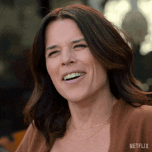 smiling maggie mcpherson neve campbell the lincoln lawyer happy