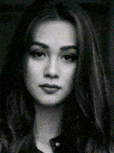 a black and white photo of a woman 's face with a grid pattern