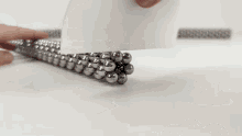 a bunch of metal balls are on a table