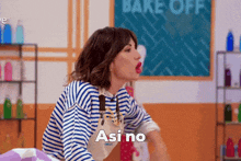 a woman in a striped shirt and apron says " asi no "