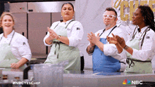 a group of chefs are applauding in a kitchen with a nbc logo in the corner