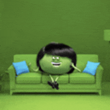a cartoon character is sitting on a green couch in a green room .